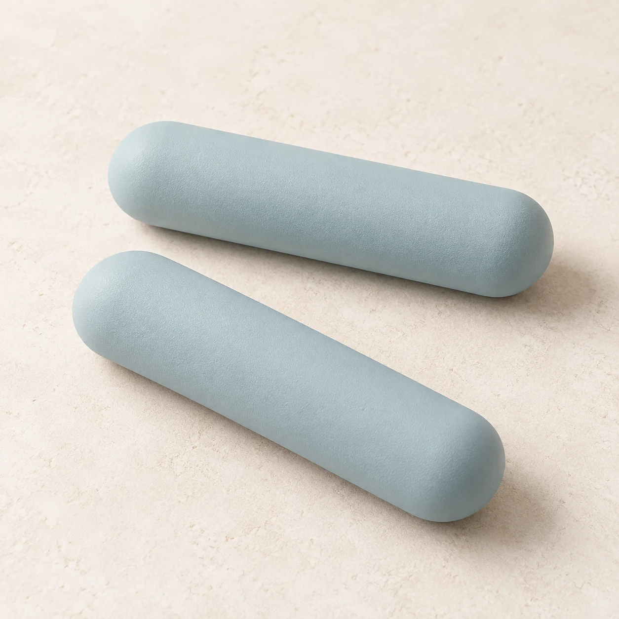 AI-generated concept of two straight capsule-shaped hand weights with rounded ends; checkout covers the 2 kg-per-piece pair